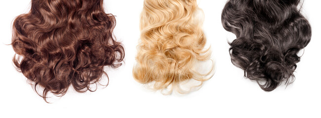 Brown, blonde and black hair on white background. Wavy long different curly hair. Hair extensions,...