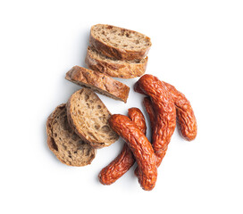 Smoked pork sausages and bread on white background.