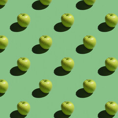 Seamless pattern with a green apple on a green background. Modern style isometric concept