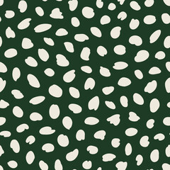 Irregular polka dot seamless repeat pattern on green background. Random placed, vector spots all over surface print. © MoJX.Studio