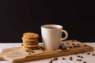 Latte with cookies on wood standing and coffee beans. Isolated background