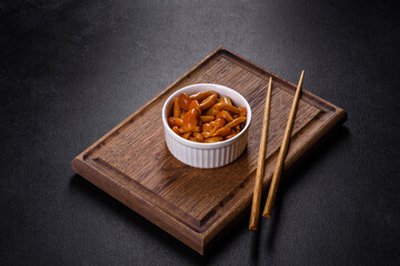 Homemade pickled honey agarics mushrooms in a white bowl