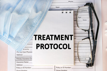 the treatment protocol is written on a notebook that is on the sick-list. Medical mask and eyeglasses - obrazy, fototapety, plakaty
