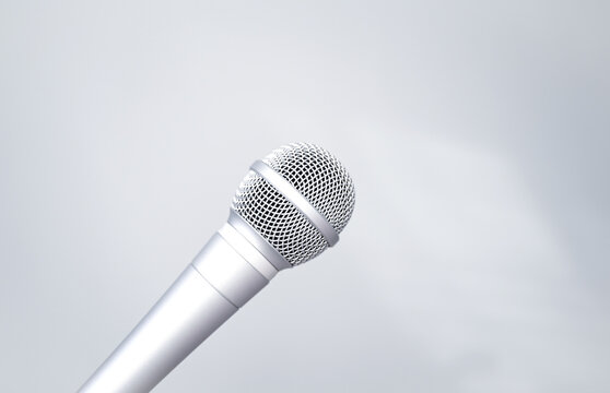 silver microphone on a gray background. close-up of a microphone. voice recording. 