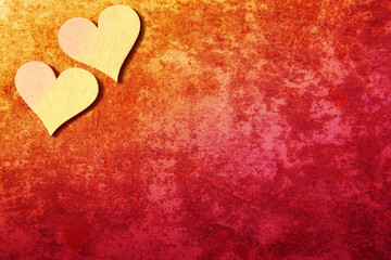 Valentines hearts on yellow-red stone background with copy space