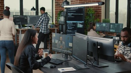 Software company employee in video call conference with business owner discussing coding project deadline in office with team working. Programer having online chat with client about source code. - Powered by Adobe