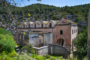 Fototapeta na wymiar Abandoned church in Kayakoy also known as Karmilissos or Ghost Town. Fethiye, Mugla Province, southwestern Turkey.