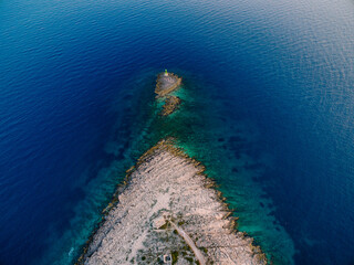 Aerial view of a small island in front of Punta Planca cape
