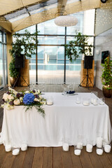 wedding table with flowers and candles blue dress code