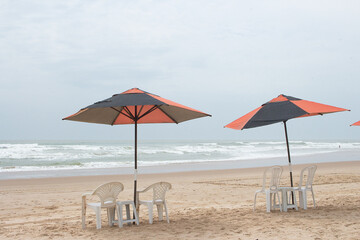 beautiful landscape with beach chair and a parasol on a sunny day.