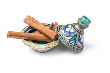 Cinnamon sticks in a mini Moroccan tagine