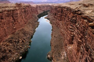 Marble Canyon of Colorado River seen from historic Navajo Bridge in Arizona, USA, on overcast day