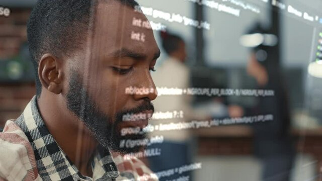 Portrait of african american software developer through vfx of floating programming code working focused while typing. System engineer writing algorithm for innovative artificial intelligence.