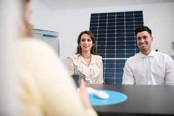 couple in an establishment decide on buying solar panels for their home
