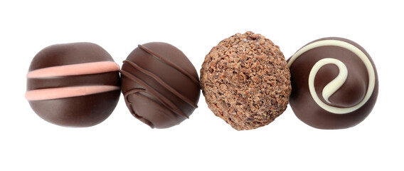 Many different delicious chocolate truffles on white background, top view