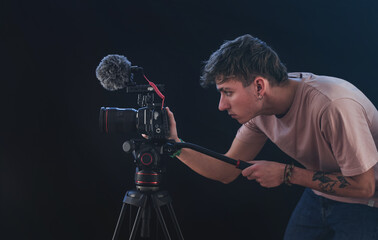 Filmmaker or cinematographer shooting with a professional camera cinematic videos. Documentaries,...