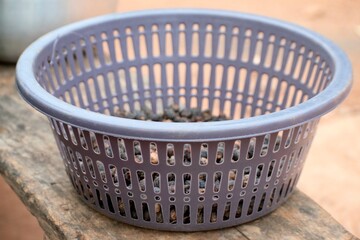 a basket of tiger nuts on a bench