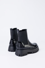 Women's black boots with genuine leather on a rough sole without laces. New collection of women's spring shoes
