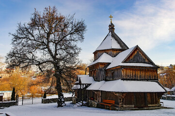 Old wooden church in Kamianets-Podilskyi, Ukraine at sunny winter day