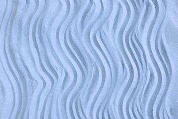Drawing of waves on the sand on the beach, sand pattern