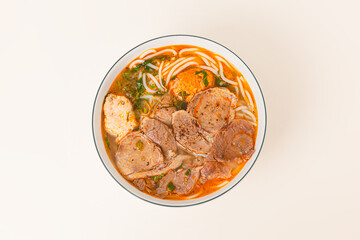 Bun Bo Hue, Vietnamese spicy beef rice noodle soup, Vietnamese food isolated on white background, top view