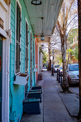 An Empty Stretch of Sidewalk Lined by Colorful Homes in the French Quarter of New Orleans,...