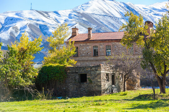 Akhty fortress in Dagestan. The southernmost fortress in Russia, founded in 1839. Abandoned ruins and the castle buildings. Stone walls of fortifications on the background of snowy mountains