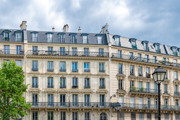 Fototapeta na wymiar Paris, typical facades and street, beautiful buildings rue du Temple
