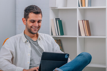 man at home with laptop