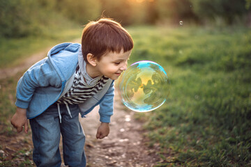 child playing with bubbles