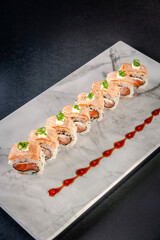 Uramaki blowtorcherd salmon.