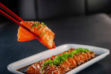 Salmon sashimi with shoyu and miso sauce.