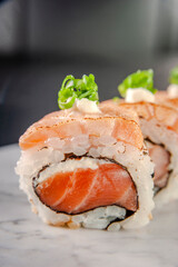 Uramaki blowtorcherd salmon.