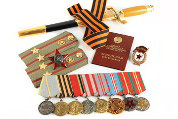 Orders and medals of the veteran on the St. George ribbon. MAY 9 greeting card. White background.