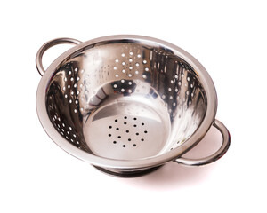 Stainless steel colander on a white background