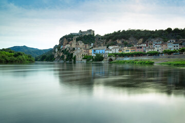 Fototapeta na wymiar View of the Ebro river and the village of Miravet in the province of Tarragona. Catalonia, Spain. Rural tourism.