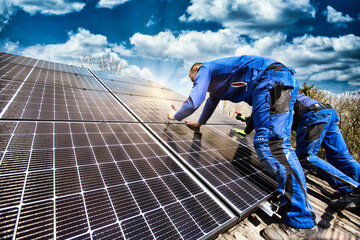 Installing solar photovoltaic panel system. Solar panel technician installing solar panels on roof....