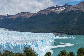 Glacier landscape upper view with mountains, and recent melting on the lake surface