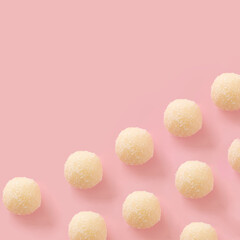 white chocolate balls on a soft pink background.flat lay cookies pattern idea.holidays valentine concept.aesthetic food design.celebrations