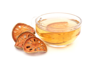 Bael or aegle marmelos fruits and tea isolated on white background.