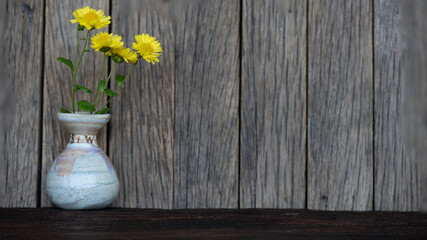 Chrysanthemum flowers isolated on an old wood background.