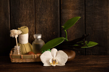 Aromatherapy with vanilla scent on an old wood background.