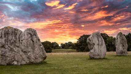 Avebury stone circle at sunrise. Neolithic sarsen sones. Pagan monument.