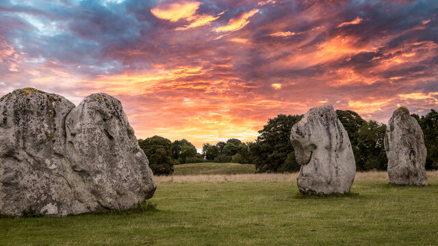 Avebury stone circle at sunrise. Neolithic sarsen sones. Pagan monument.