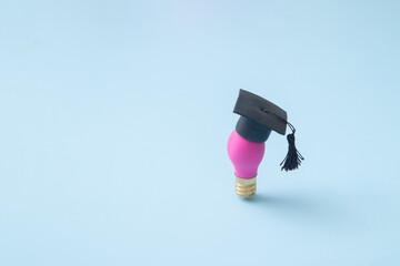 A lamp with a graduation hat. A symbol of creative education, idea for learning, business education