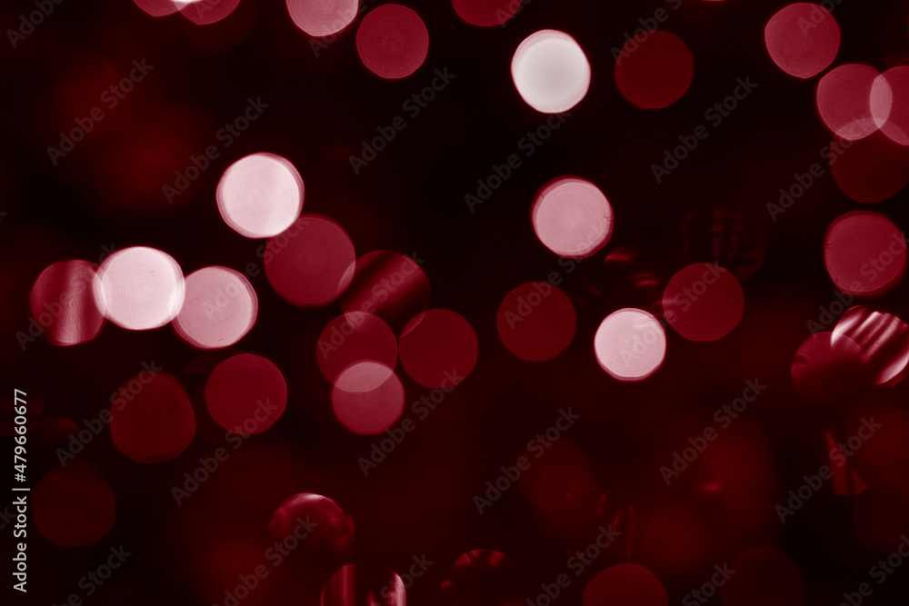 Poster bokeh closeup photo of colorful red lights. abstract circular bokeh background of red christmas ligh