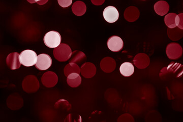 Bokeh closeup photo of colorful red lights. Abstract circular bokeh background of red Christmas lights