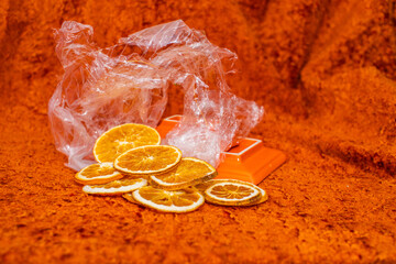 Group of slices oranges on orange background,top view. High quality photo