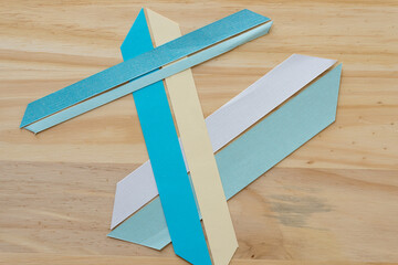 background with paper shapes on wood