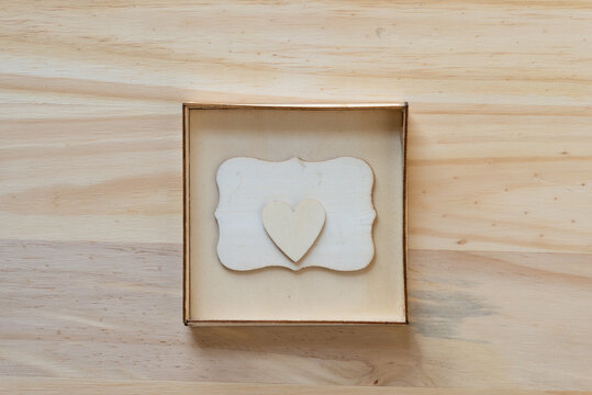 wooden heart isolated inside a box